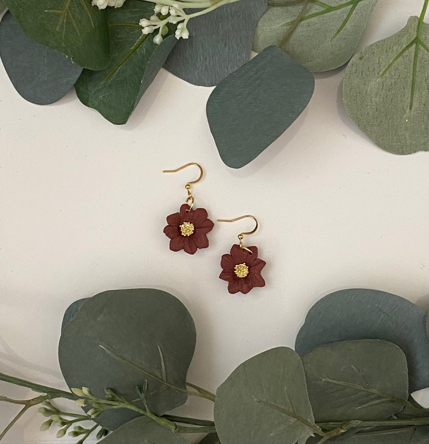 Maroon flowers in gold