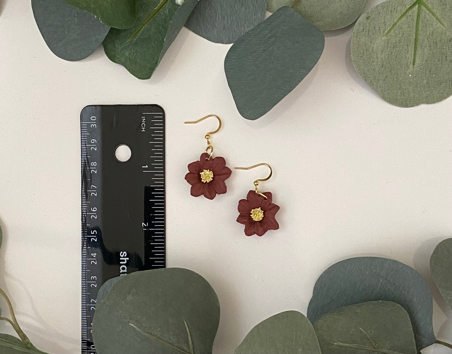 Maroon flowers in gold